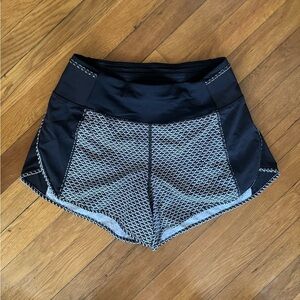 Lululemon athletic shorts size 4 black w/ black & white detail. Great condition